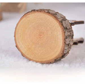 Detail view of the flat bottom on a natural wooden Christmas tree stand with bark edge