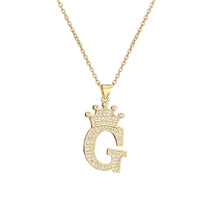 Macro detail of gold-plated crown initial G pendant necklace with sparkling zircons