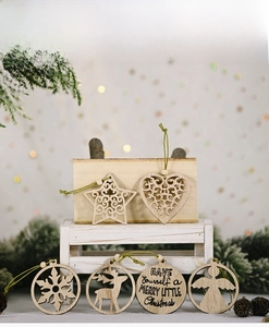 Macro shot of assorted hollow wooden Christmas ornaments with strings and wooden beads