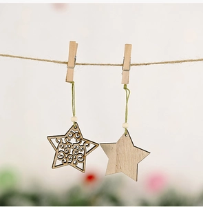 Close-up of star-shaped wooden ornaments with hollow design and beads on hemp rope