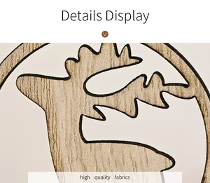 Macro detail of natural wood grain and reindeer pattern on minimalist Christmas ornament