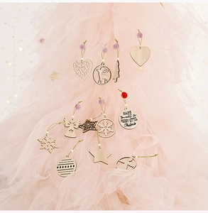 Macro detail of wooden Christmas ornaments with festive carvings and decorative beads