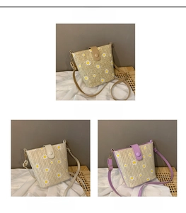 Detail view of khaki, white, and purple straw bucket bags with daisy patterns