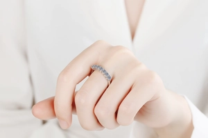 Detailed view of a 925 sterling silver ring with five round cut moissanite stones
