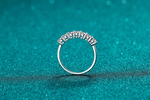 Detailed close-up of a silver 925 ring with seven sparkling moissanite stones