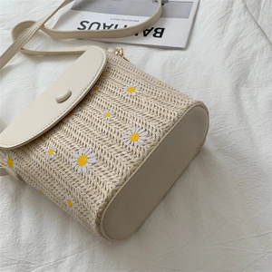 Chic woven straw bucket bag with white daisy embroidery and beige PU leather flap