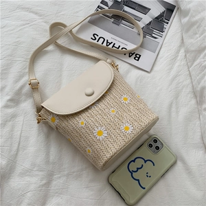 Straw bucket bag with white daisy embroidery and PU leather flap for summer style
