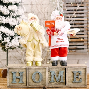 Standing Santa Claus figurines in gold and red festive costumes for Christmas decor