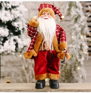 Standing Santa Claus doll wearing red plaid coat with brown plush trim holding gold bag