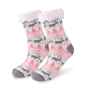Sherpa lined winter thermal socks with knit reindeer and snowflake pattern on white background
