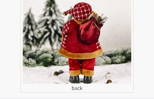 Back view of a standing Santa Claus figurine wearing a red plaid coat with a gift bag
