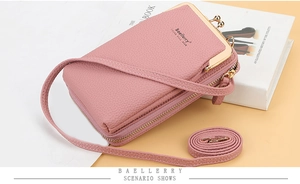Detail view of pink lychee pattern PU leather phone bag with golden metal clasp