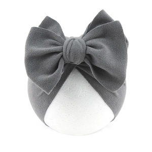 Detailed view of the soft grey velvet bow knot design on this cozy infant turban hat