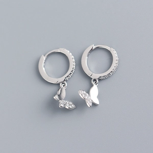Detailed macro view of S925 sterling silver butterfly earrings with sparkling cubic zirconia