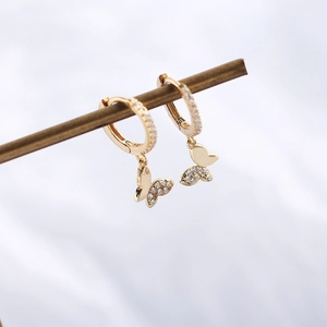 Close-up of S925 silver gold-plated butterfly earrings with sparkling cubic zirconia