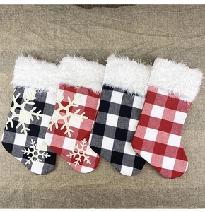 Set of 4 plaid Christmas stockings with white faux fur trim and snowflake applique decor