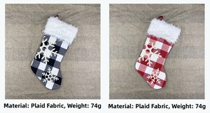 Detail view of plaid Christmas stockings with white faux fur trim and snowflake patches