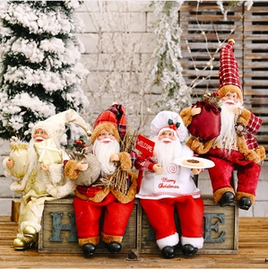 Set of four plush Santa Claus figurines in gold, red and white holiday costumes