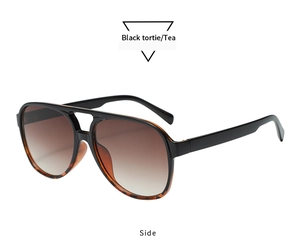 Side view detail of retro double-bridge pilot sunglasses with black tortie frames and tea lenses