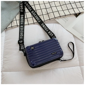 Mini suitcase-style crossbody bag in navy blue with Forever Young logo strap and hard shell