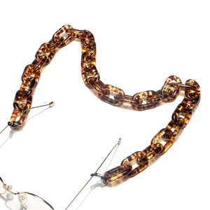 Stylish leopard amber resin glasses chain with chunky links on a clean white background