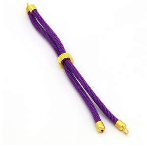 Detail of purple braided DIY bracelet cord with adjustable gold metal slider clasp