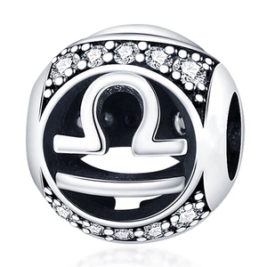 Detailed macro view of silver Libra zodiac bead charm with sparkling clear zircons