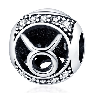 Macro shot of silver Taurus zodiac charm bead with white cubic zirconia inlay