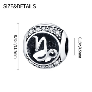 Silver Capricorn zodiac charm with white diamonds and size details on white background