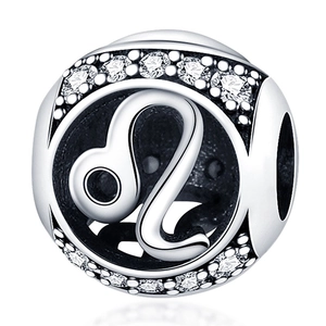 Macro shot of silver Leo zodiac charm with sparkling cubic zirconia for DIY jewelry