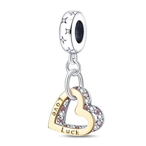 Silver bead with stars and double gold and silver heart charms with Love Luck engraving