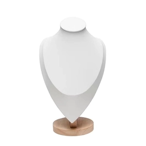 Detail showing white leather necklace display bust with round solid wood base