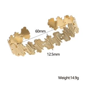 Detailed size view of a gold leaf open bangle showing 60mm diameter and 12.5mm width