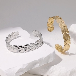 Adjustable stainless steel leaf cuff bracelets in gold and silver finish set of two