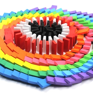 Wooden rainbow dominoes set, colorful blocks arranged in spiral shape, early education toy.