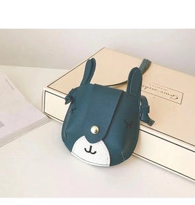 Detail view of cartoon animal kid crossbody bag with textured PU leather and gold clasp