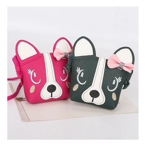 Detail of rose red and dark green puppy shoulder bags with cute bows for children