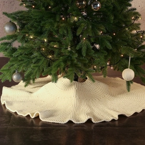 Knitted off-white Christmas tree skirt with thick needlework for holiday home decoration