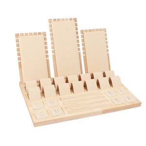 Wooden jewelry display set with beige velvet stands for necklaces, rings and bracelets