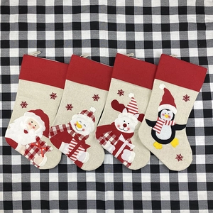 Set of four large Christmas stockings with Santa, Snowman, Reindeer and Penguin characters
