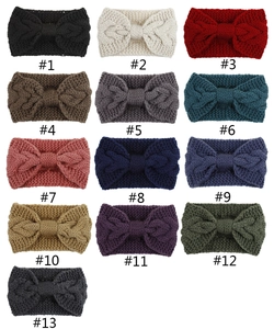 Overview of thirteen different colors of cable knit bow headbands for autumn and winter