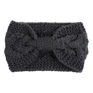 Detailed knit texture of a dark grey twisted cable headband with a front bow design