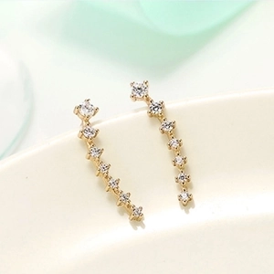 Elegant gold curved stud earrings featuring sparkling white zircon row stones for women
