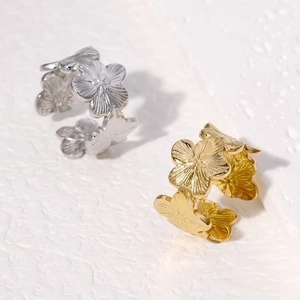 Floral stainless steel open ring set in gold and silver finish with embossed petal texture