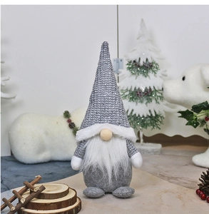 Detail of grey gnome figurine with sequin knit hat and long white beard for Xmas decor