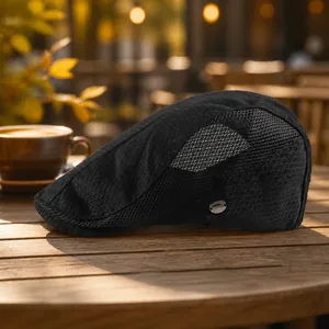 Breathable black mesh ivy cap with honeycomb texture and metal brand tag detail