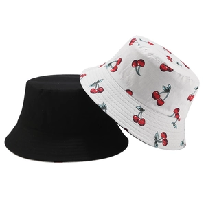 Detail of black and white cherry print reversible cotton bucket hat for women