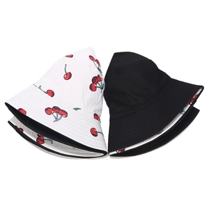 Detail of reversible black bucket hat with white cherry print lining and stitching