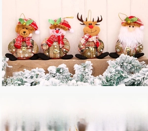 Detail view of four plush Christmas ornaments including Santa and reindeer with metal bells