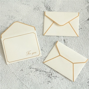 Three elegant cream-white envelopes with gold edges and 'For you' script for gift cards